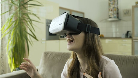 Young woman having fun with virtual reality