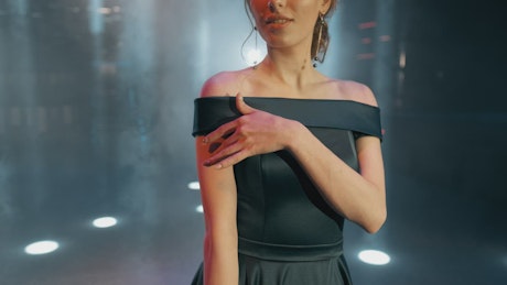 Young woman in a formal black dress.