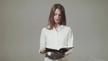 Young woman reading the Bible.