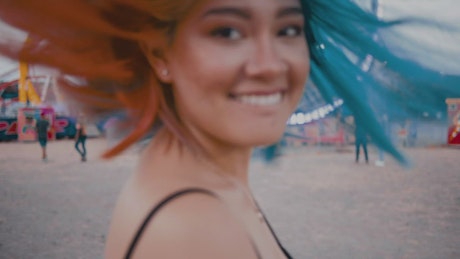 Young woman smiling at the fair.