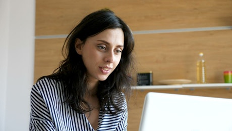 Young woman working in her office happily