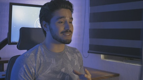 Youtuber vlogging in his studio.