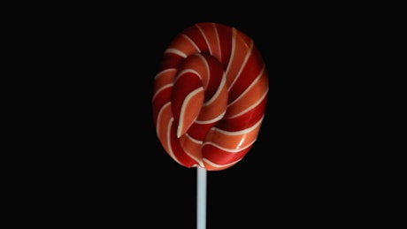 Yummy spiral lollipop spinning.