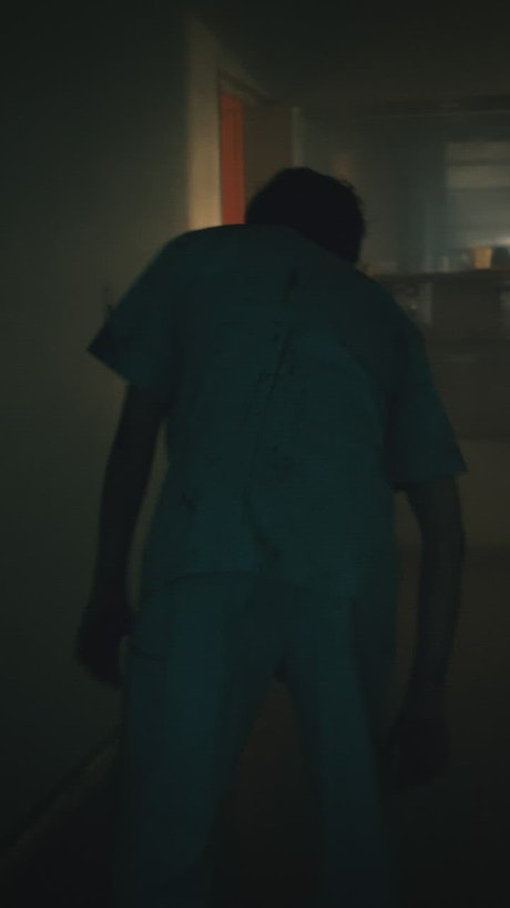 Zombie prowling the corridors of a hospital.